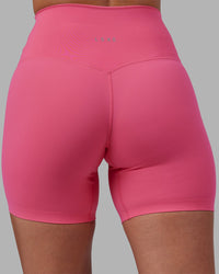 Woman wearing Elixir High-Rise 6" Short - Hot Pink | Model:Rhiley | Size:S