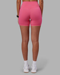 Woman wearing Elixir High-Rise 6" Short - Hot Pink | Model:Rhiley | Size:S