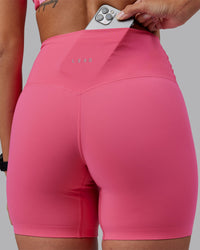 Woman wearing Elixir High-Rise 6" Short - Hot Pink | Model:Rhiley | Size:S