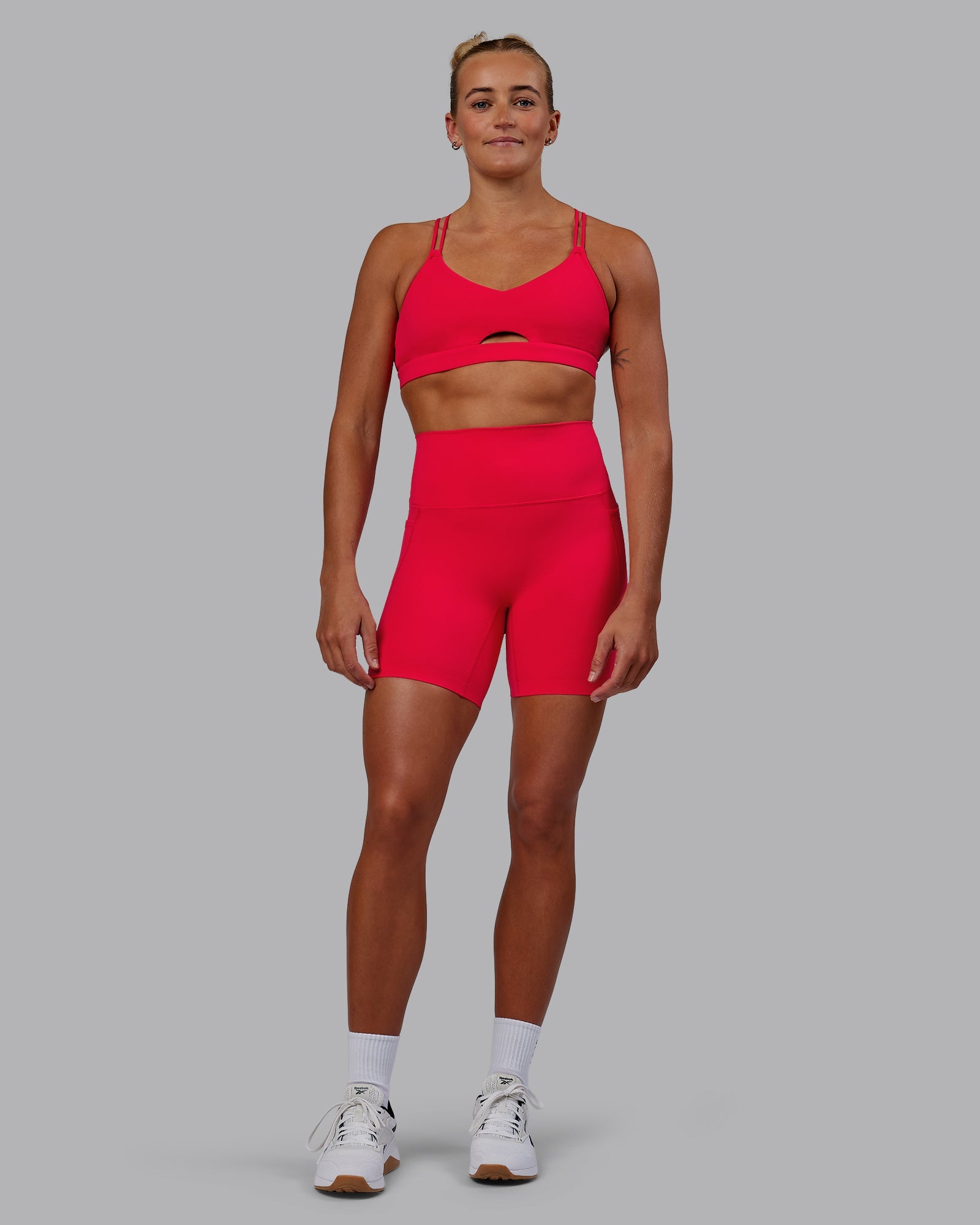 Woman wearing Elixir Ultra High-Rise 6" Short Pockets - Scarlet