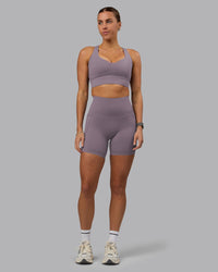 Woman wearing Elixir Ultra High-Rise 6" Short Pockets - Purple Sage
