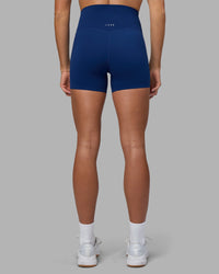 Woman wearing Elixir Ultra High-Rise 4" Short - Midnight Blue | Model:Katie | Size:S