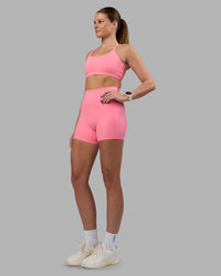 Woman wearing Elixir Ultra High-Rise 4" Short Pockets - Candy Pink | Model:Phoebe | Size:S