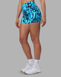 Woman wearing Elixir Ultra High-Rise 4" Short Pockets - Luminous | Model:Sophie | Size:S
