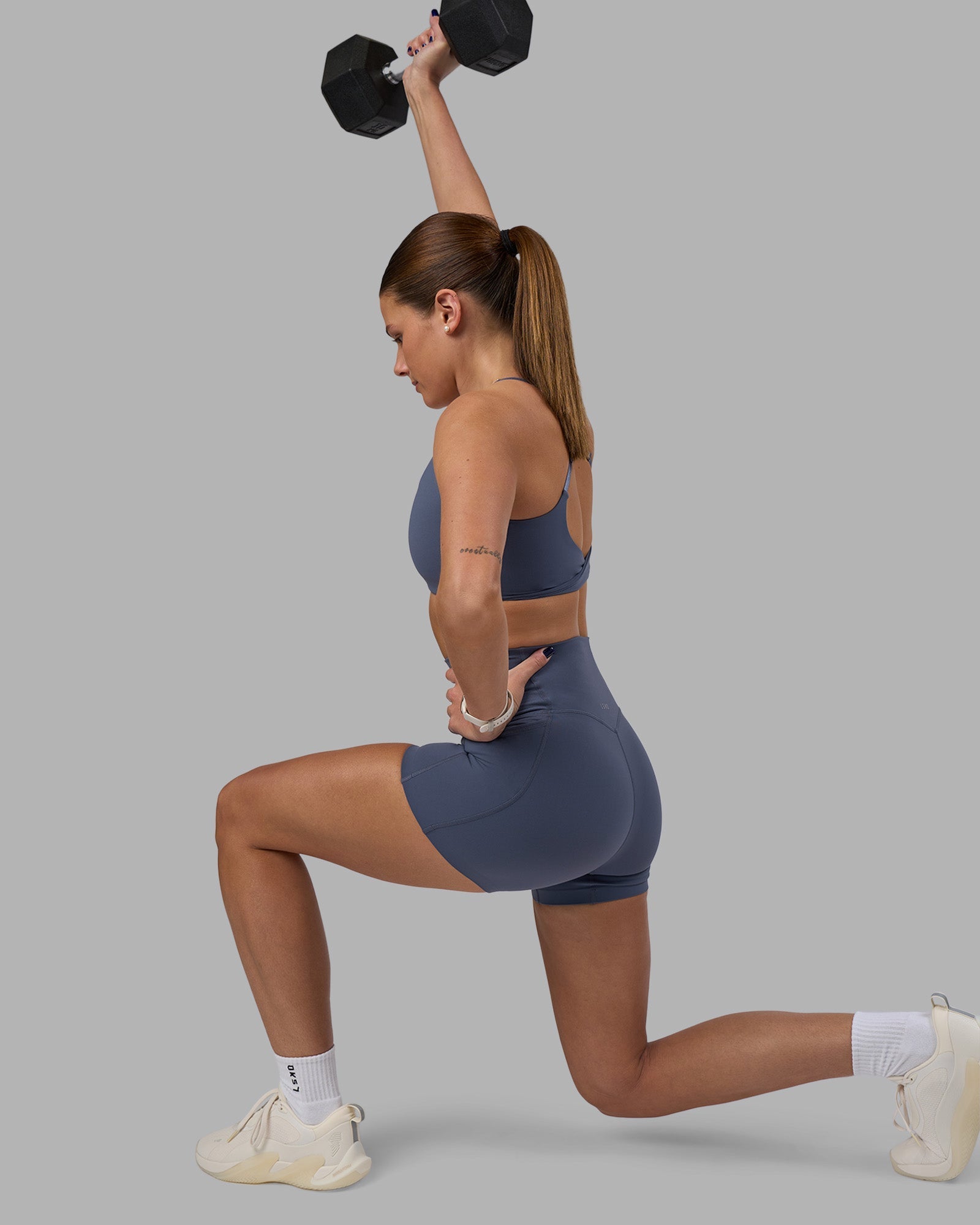 Woman wearing Elixir Ultra High-Rise 4" Short Pockets - Night Shadow | Model:Phoebe | Size:S