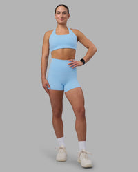 Woman wearing Elixir Ultra High-Rise 4" Short Pockets - Open Air | Model:Keisha | Size:S