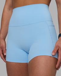 Woman wearing Elixir Ultra High-Rise 4" Short Pockets - Open Air | Model:Keisha | Size:S