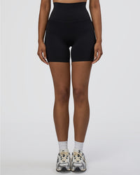 Woman wearing Elixir Ultra High-Rise 6" Short Pockets - Black | Model:Jordan | Size:S