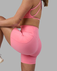 Woman wearing Elixir Ultra High-Rise 6" Short Pockets - Candy Pink | Model:Phoebe | Size:S