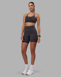 Woman wearing Elixir Ultra High-Rise 6" Short Pockets - Dark Storm Wash | Model:Rhiley | Size:S
