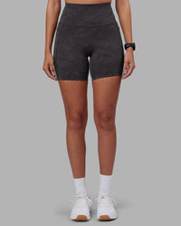 Woman wearing Elixir Ultra High-Rise 6" Short Pockets - Dark Storm Wash | Model:Rhiley | Size:S