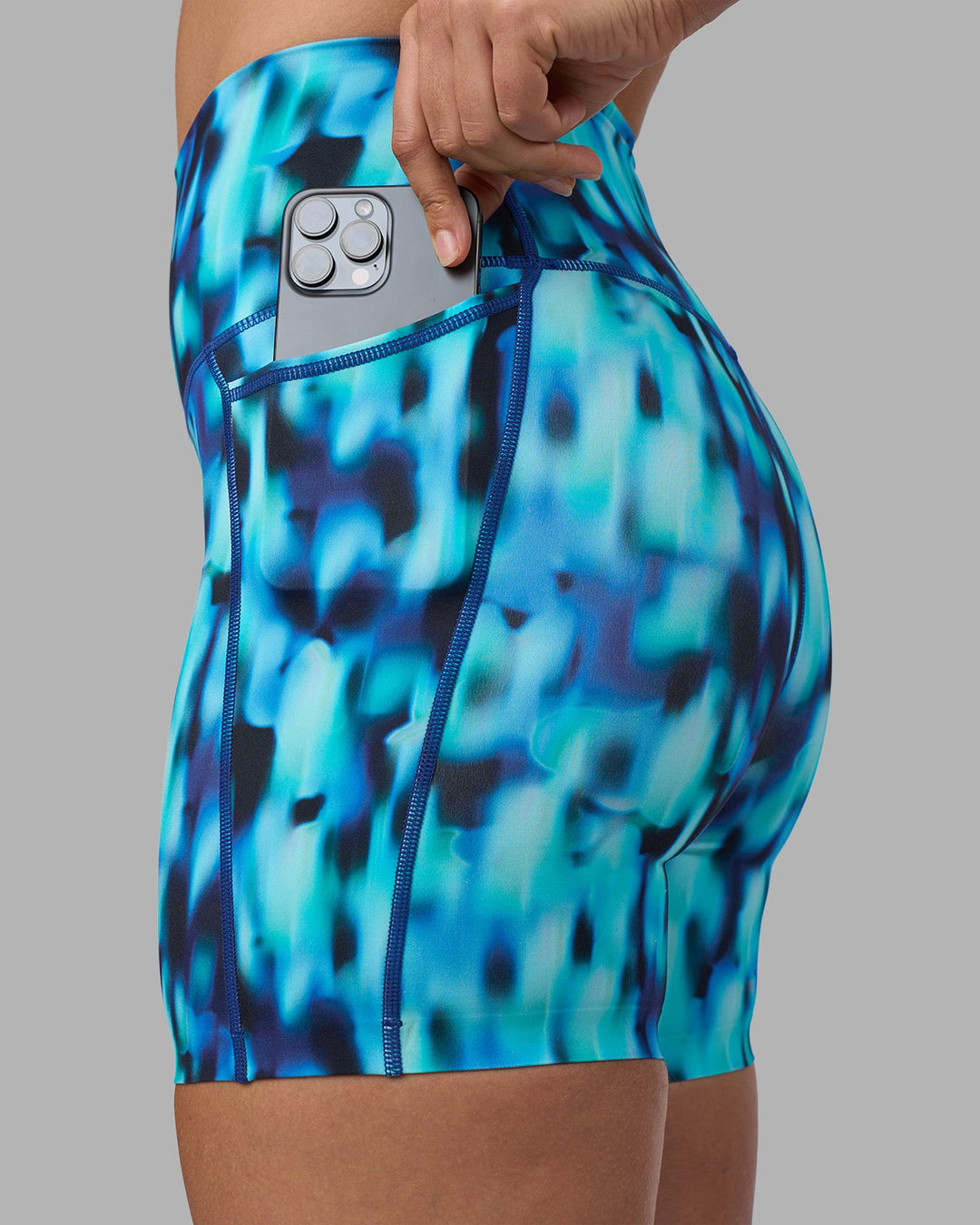 Woman wearing Elixir Ultra High-Rise 6" Short Pockets - Luminous | Model:Sophie | Size:S