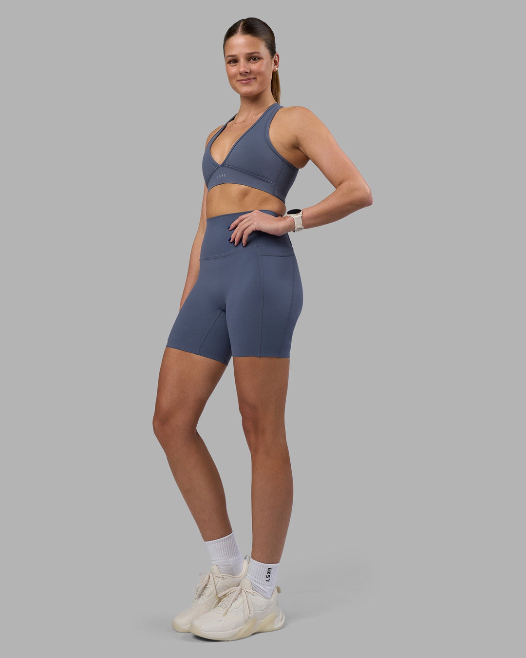 Woman wearing Elixir Ultra High-Rise 6&quot; Short Pockets - Night Shadow | Model:Phoebe | Size:S