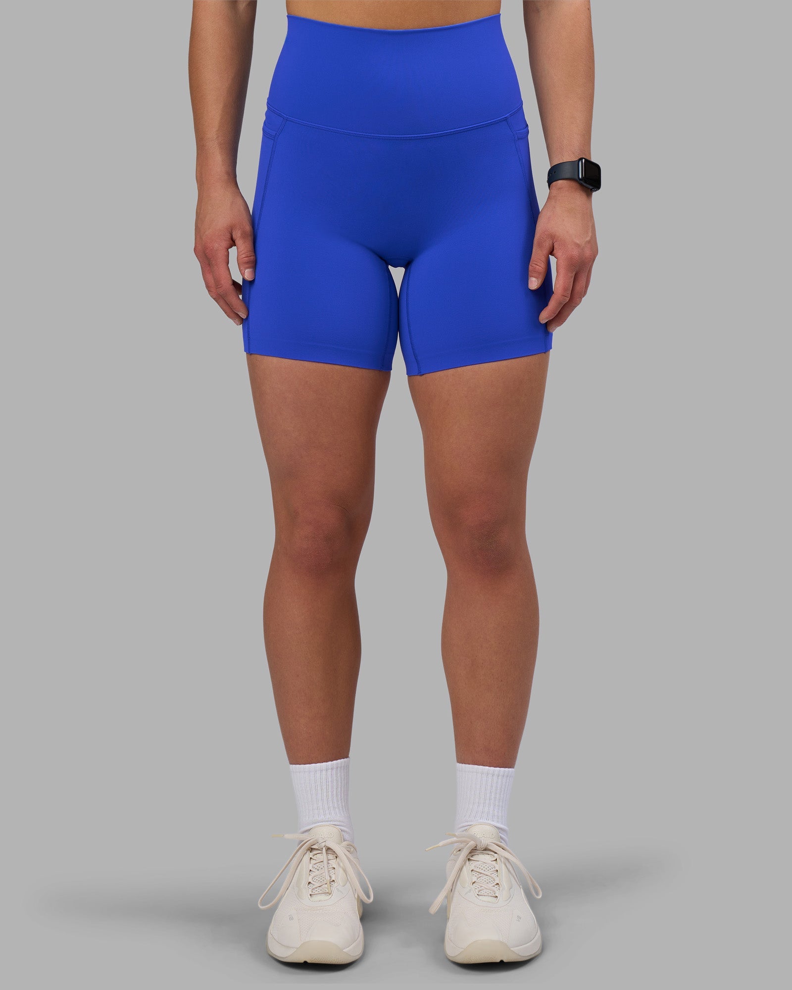 Woman wearing Elixir Ultra High-Rise 6" Short Pockets - Power Cobalt | Model:Keisha | Size:S