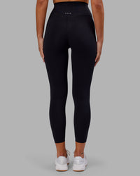 Woman wearing Elixir Ultra High-Rise 7/8 Legging - Black | Model:Kirstyn | Size:S