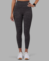 Woman wearing Elixir Ultra High-Rise 7/8 Legging Pockets - Dark Storm Wash | Model:Rhiley | Size:S