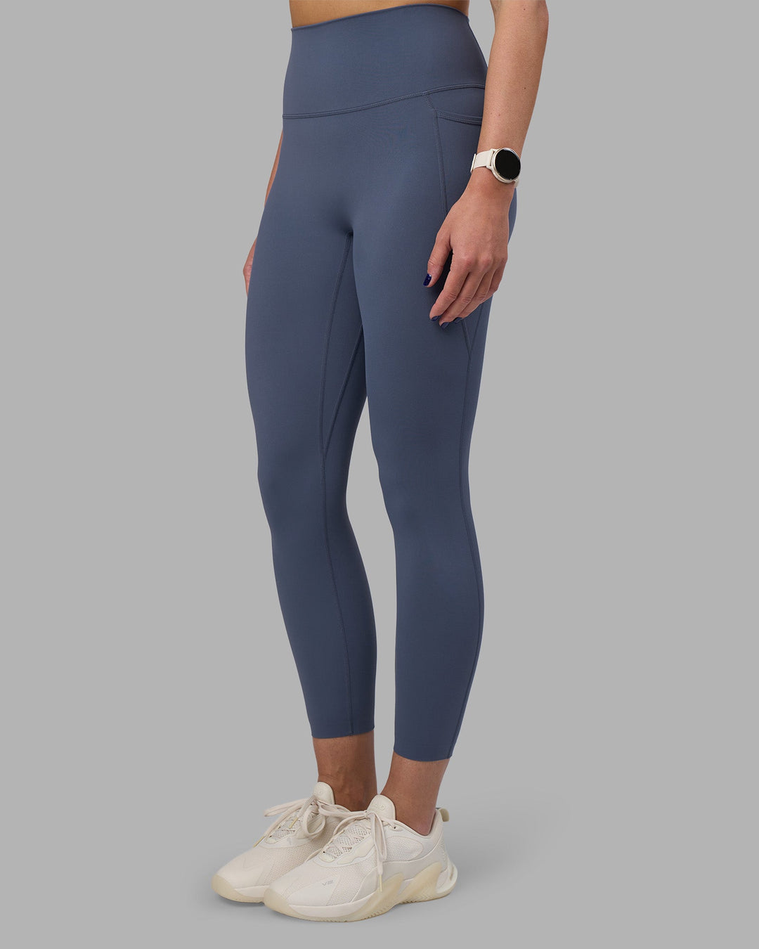 Woman wearing Elixir Ultra High-Rise 7/8 Legging Pockets - Night Shadow | Model:Phoebe | Size:S