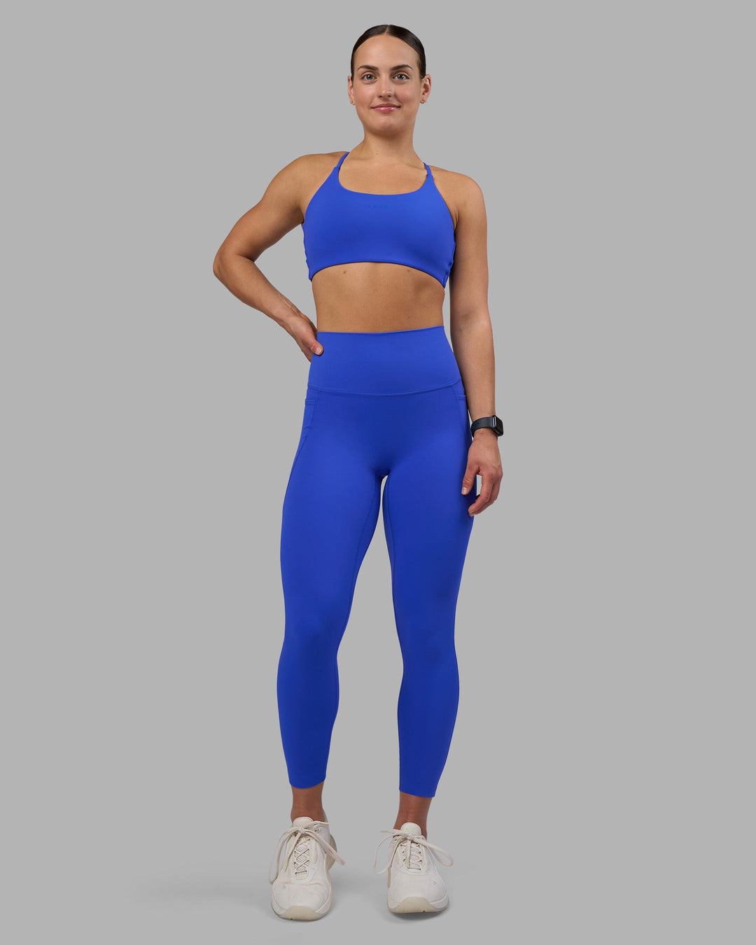 Woman wearing Elixir Ultra High-Rise 7/8 Legging Pockets - Power Cobalt | Model:Keisha | Size:S