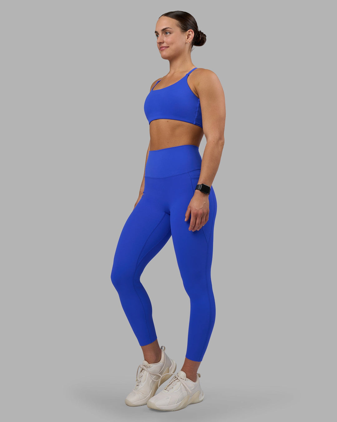 Woman wearing Elixir Ultra High-Rise 7/8 Legging Pockets - Power Cobalt | Model:Keisha | Size:S