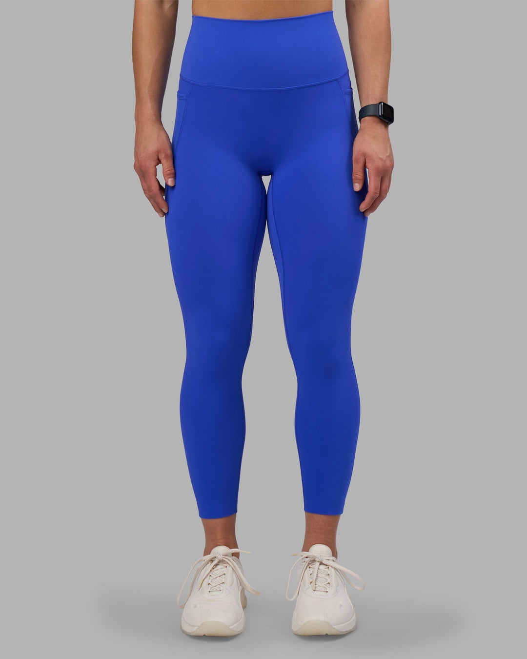 Woman wearing Elixir Ultra High-Rise 7/8 Legging Pockets - Power Cobalt | Model:Keisha | Size:S