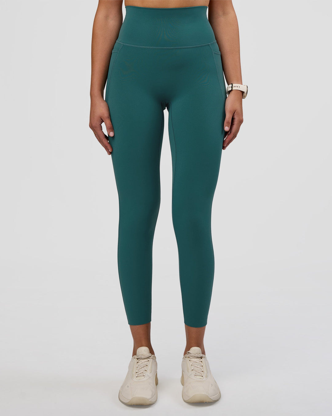 Woman wearing Elixir Ultra High-Rise 7/8 Legging Pockets - Transformative Teal | Model:Myrte | Size:S - view 6