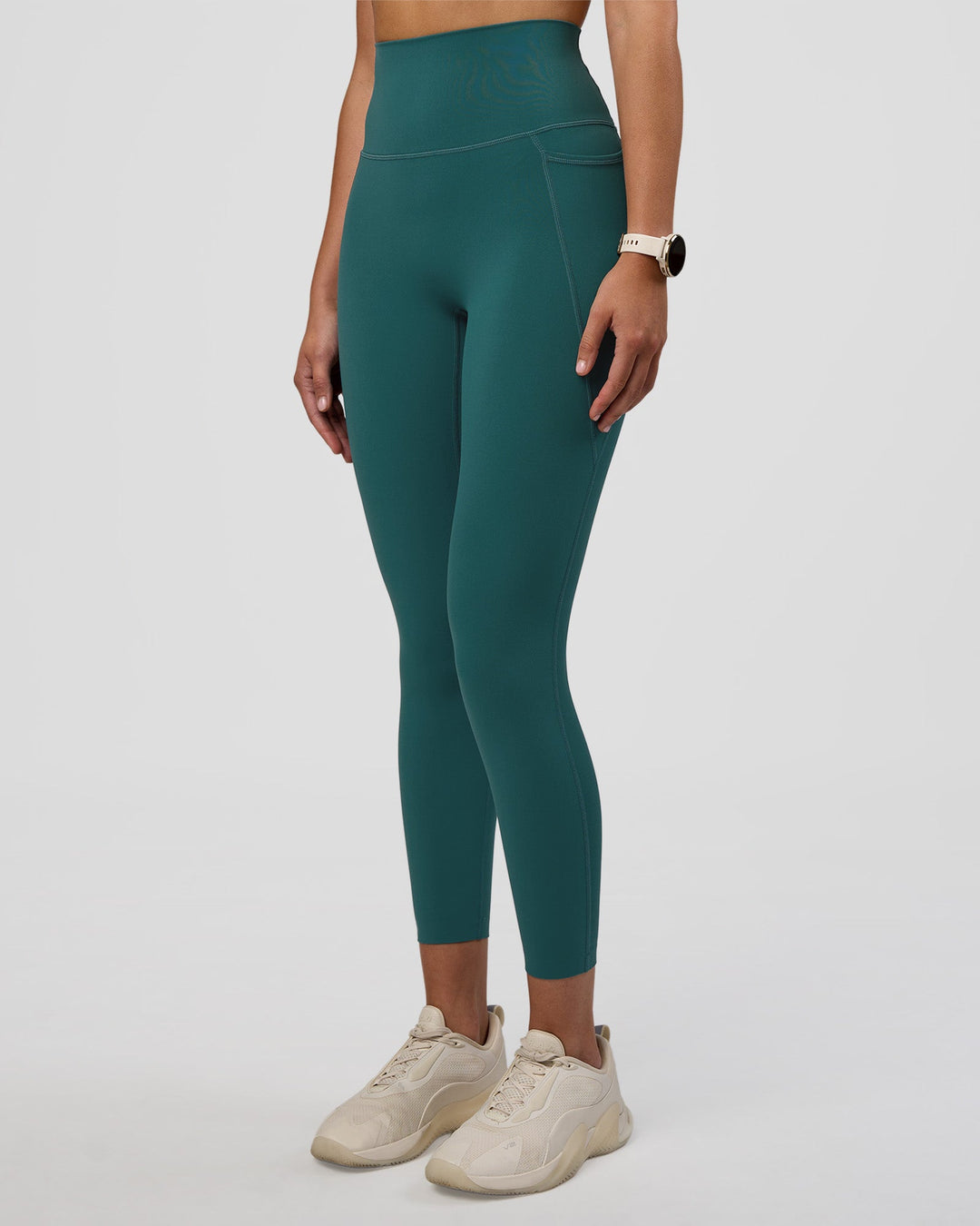 Woman wearing Elixir Ultra High-Rise 7/8 Legging Pockets - Transformative Teal | Model:Myrte | Size:S - view 2