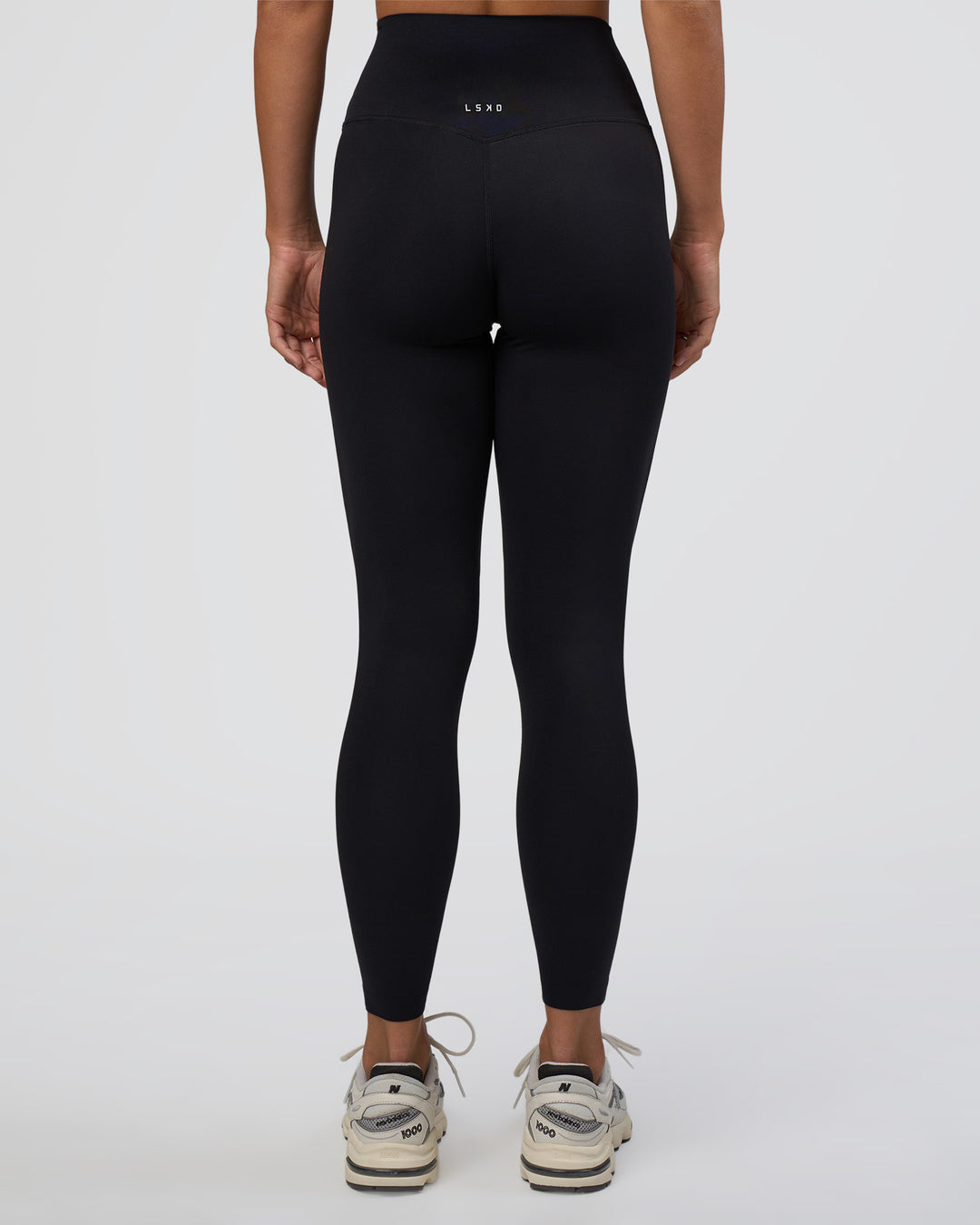 Woman wearing Elixir Ultra High-Rise Full Length Legging - Black | Model:Amity | Size:S