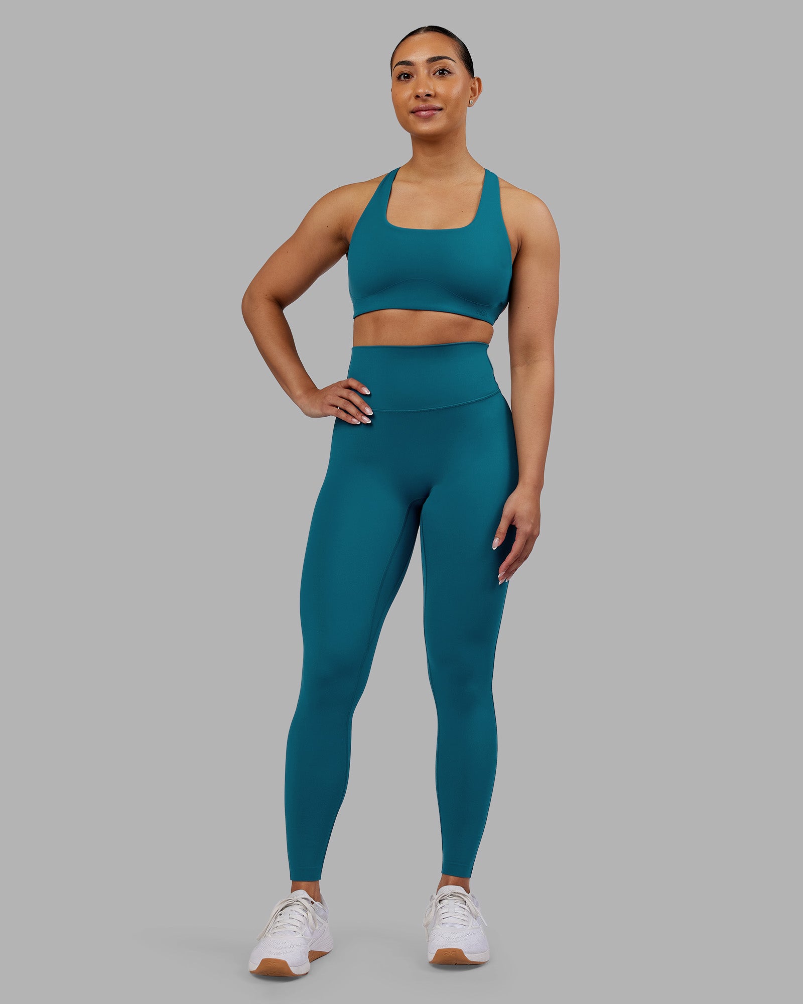 Woman wearing Elixir Ultra High-Rise Full Length Legging - Blue Coral | Model:Ayla | Size:S