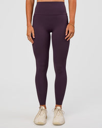 Woman wearing Elixir Ultra High-Rise Full Length Legging Pockets - Midnight Plum | Model:Emelia | Size:S