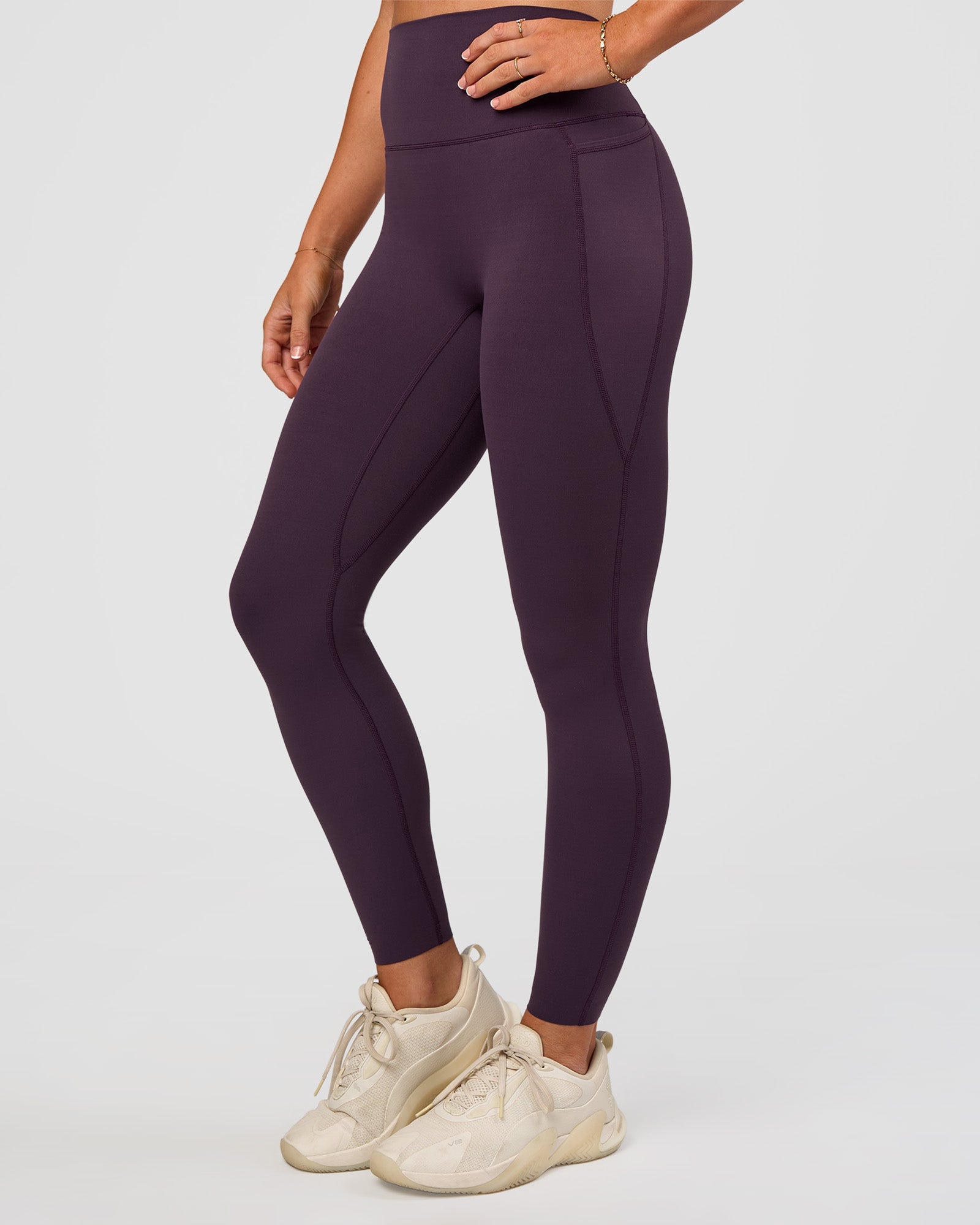 Woman wearing Elixir Ultra High-Rise Full Length Legging Pockets - Midnight Plum | Model:Emelia | Size:S