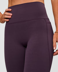 Woman wearing Elixir Ultra High-Rise Full Length Legging Pockets - Midnight Plum | Model:Emelia | Size:S