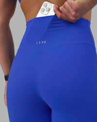 Woman wearing Elixir Ultra High-Rise Full Length Legging - Power Cobalt | Model:Keisha | Size:S