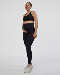 Woman wearing Elixir Ultra High-Rise Maternity Full Length Legging Pockets - Black | Model:Kitahna | Size:S