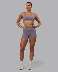 Woman wearing Elixir Ultra High-Rise 4" Short Pockets - Purple Sage