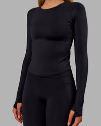 Woman wearing Embrace Thermal Long Sleeve Tee - Black | Model:Ella | Size:S