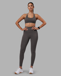 Woman wearing Empower Sports Bra - Dark Storm | Model:Rhiley | Size:S