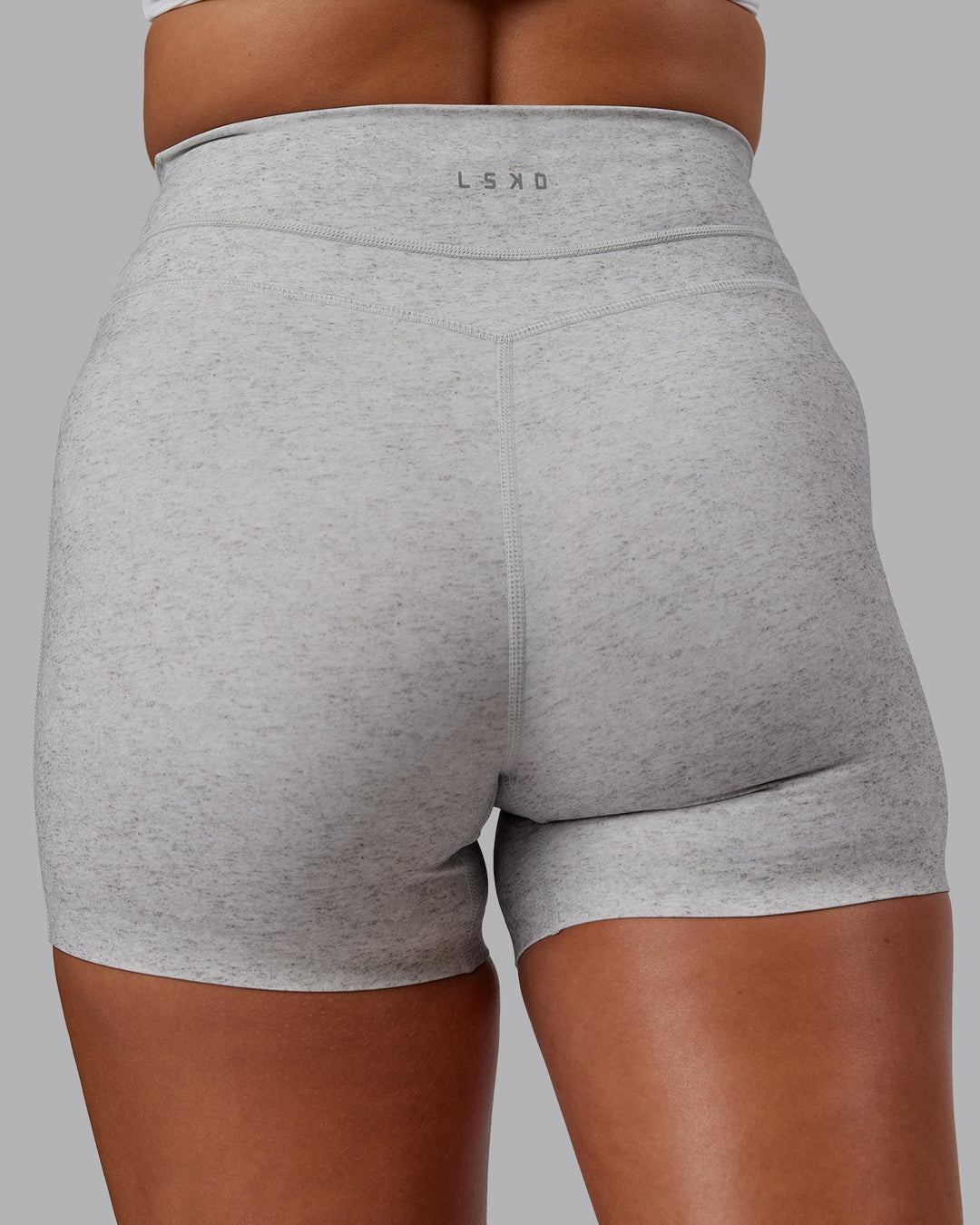 Woman wearing Enhance Ultra High-Rise 4" Short - Grey Marl | Model:Phoebe | Size:S