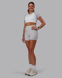 Woman wearing Enhance Ultra High-Rise 4" Short - Grey Marl | Model:Phoebe | Size:S