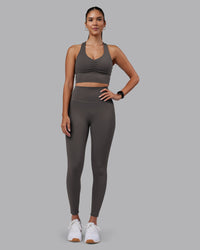 Woman wearing Evoke Longline Sports Bra - Dark Storm | Model:Rhiley | Size:S