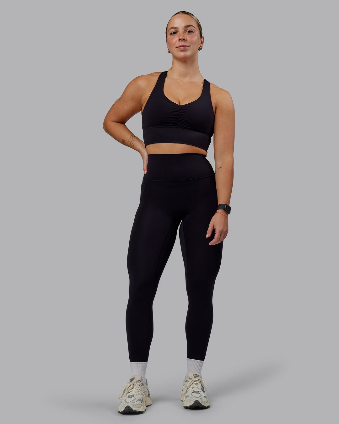 Woman wearing Evoke Sports Bra - Black