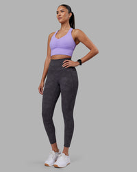 Woman wearing Evoke Longline Sports Bra - Violet Ray | Model:Rhiley | Size:S