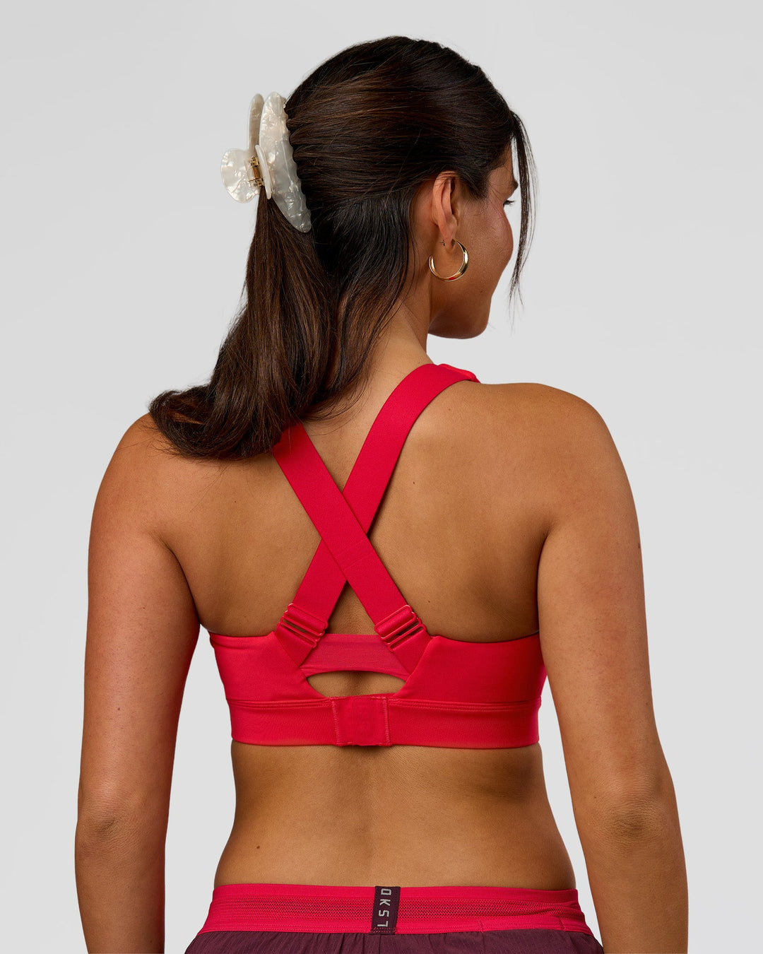 Woman wearing Fast Track Sports Bra Scarlet | Model:Rhiley | Size:S | - view 8
