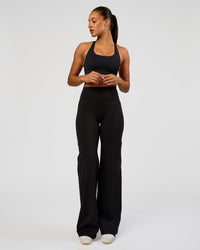 Woman wearing Flow Bonded Scoop Neck Sports Bra - Black | Model:Rosie | Size:S