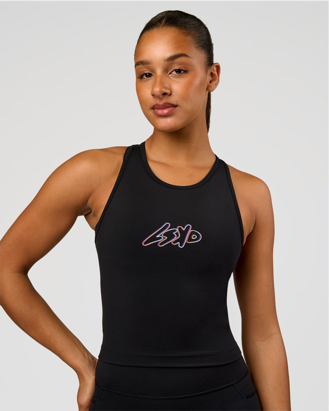 Woman wearing Flow Graphic Performance Tank 2.0 - Black-Radiate | Model:Rosie | Size:S