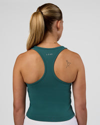 Woman wearing Flow Performance Tank 2.0 - Transformative Teal | Model:Myrte | Size:S