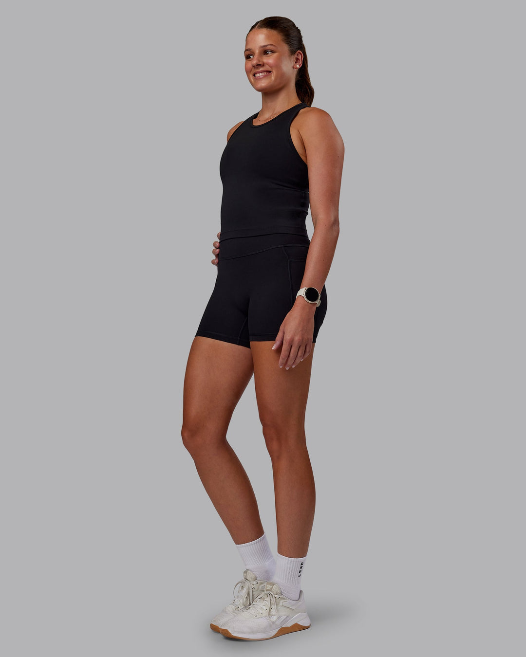 Woman wearing Flow Performance Tank - Black | Model:Phoebe | Size:S - view 4