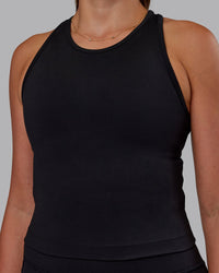 Woman wearing Flow Performance Tank - Black | Model:Phoebe | Size:S | Thumbnail Index: 0