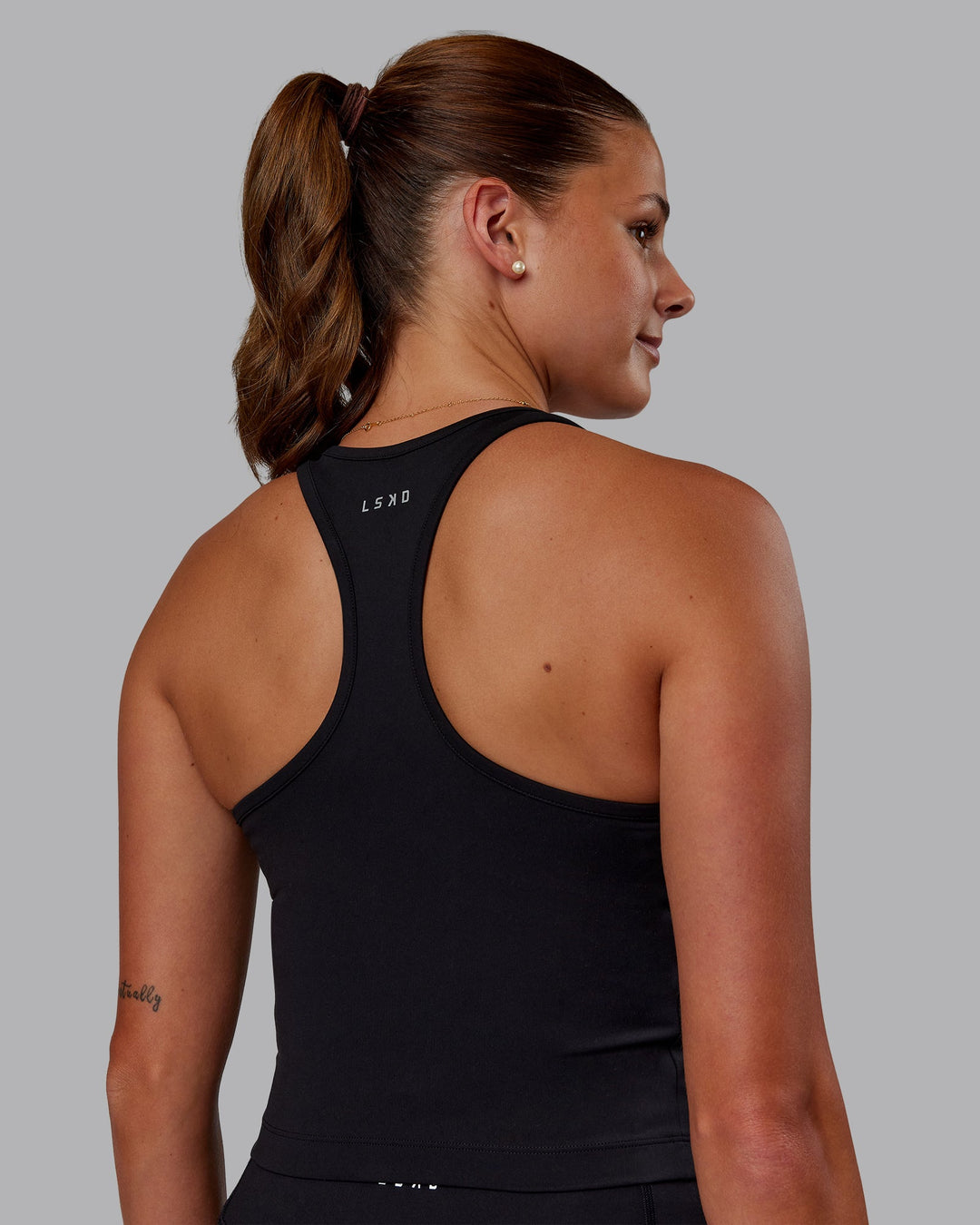 Woman wearing Flow Performance Tank - Black | Model:Phoebe | Size:S - view 6
