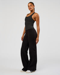 Woman wearing Flow Rib Scoop Neck Tank - Onyx | Model:Rosie | Size:S
