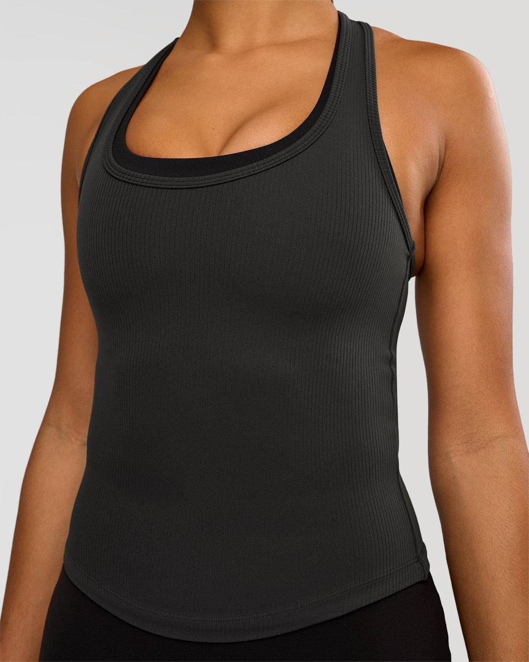 Woman wearing Flow Rib Scoop Neck Tank - Onyx | Model:Rosie | Size:S - view 1